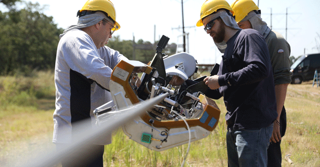 Facebook’s new robot walks along power lines to deploy fiber optic cables